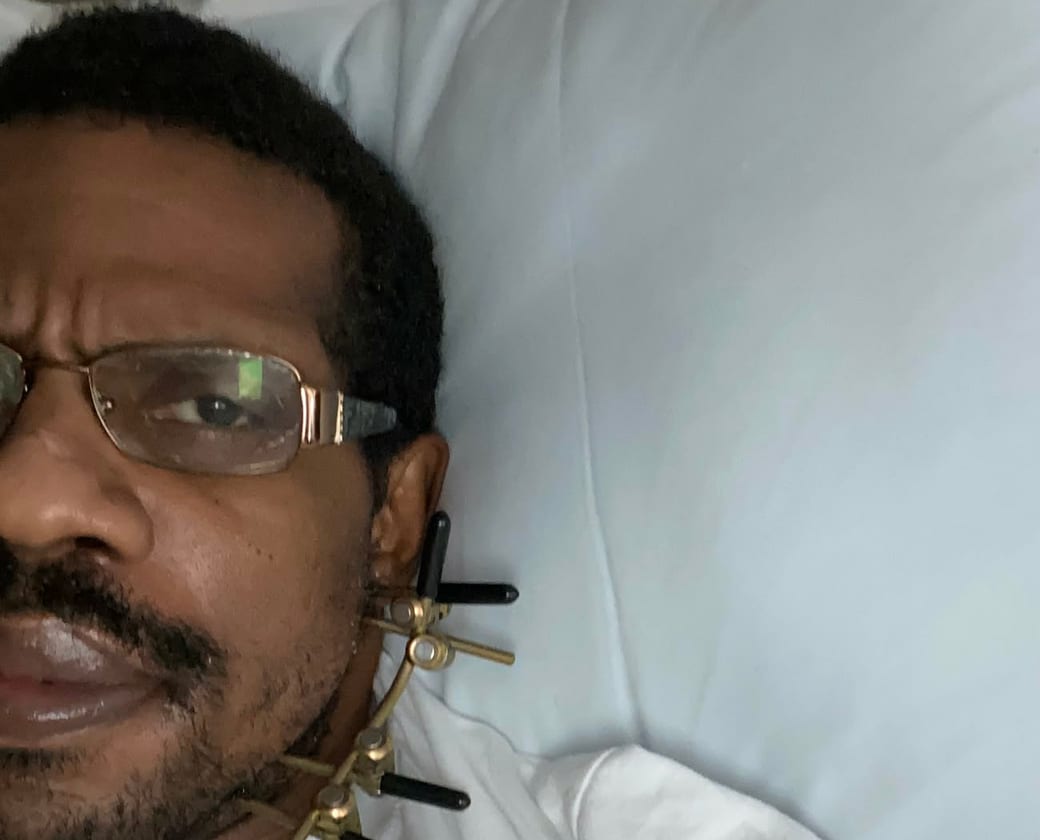 Junard in a hospital bed at the start of his recovery